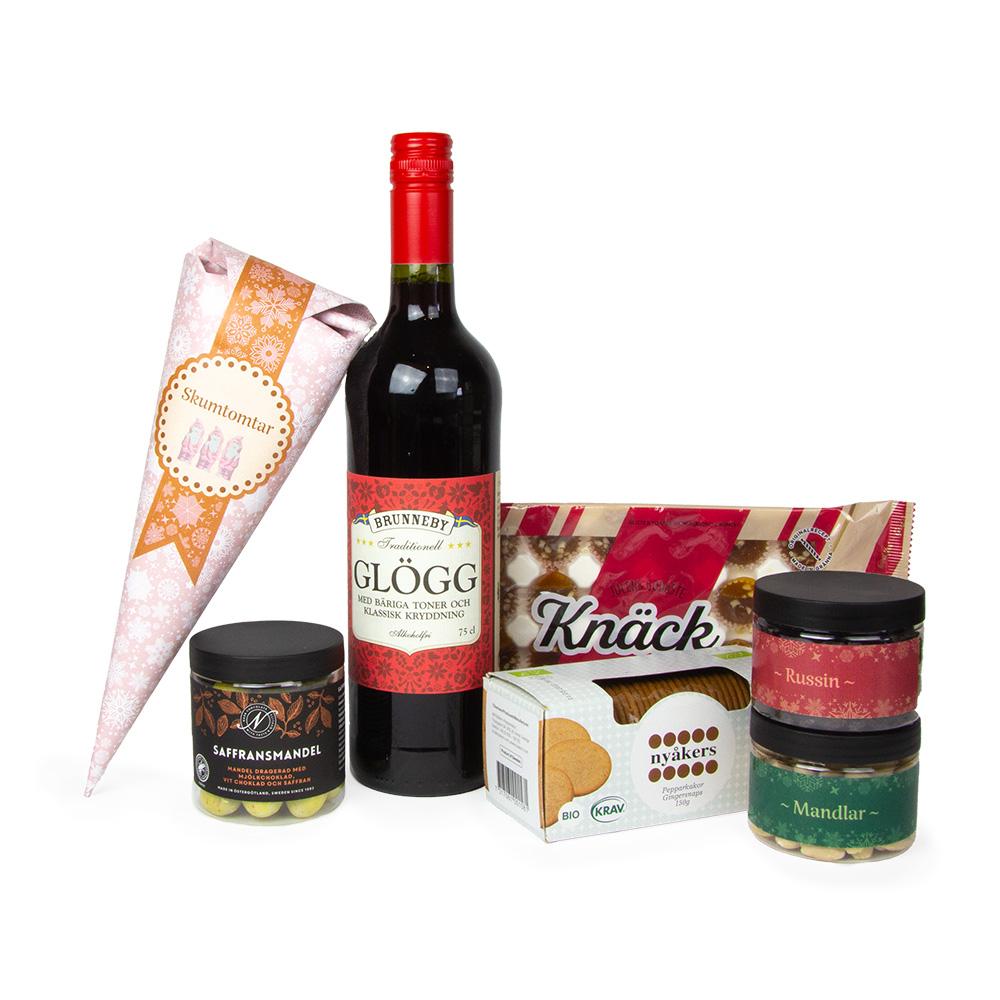Glöggkit med glögg och julens tillbehör – 2026 Innehåll i glöggkit med glögg, pepparkakor, knäck, saffransmandel, russin, mandlar och skumtomtar